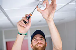 Installer connecting smart home lighting